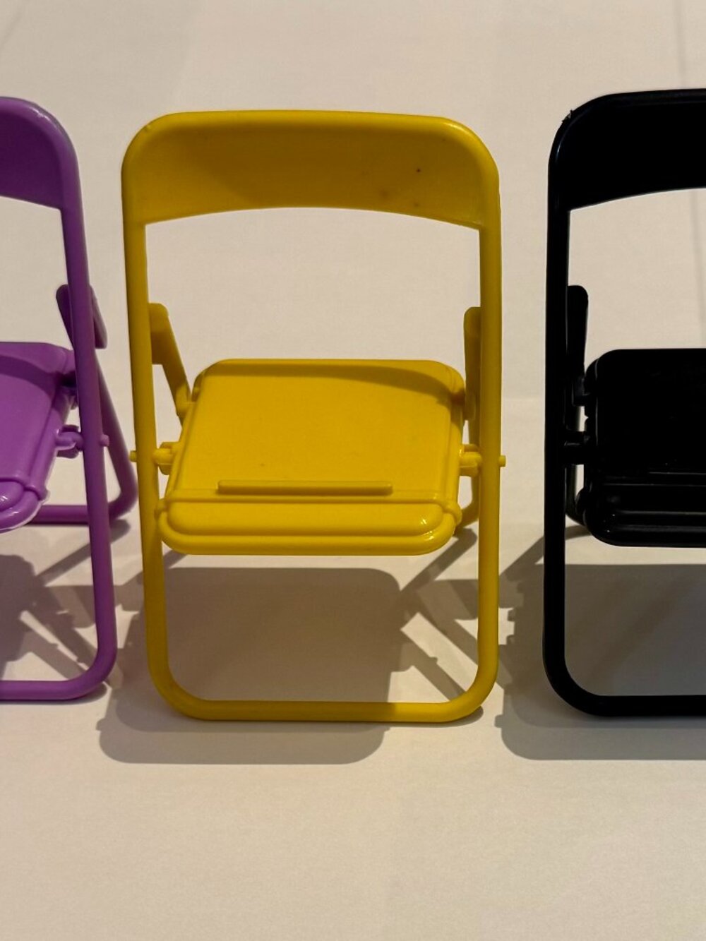 Yellow Plastic Folding Chair Cell Phone Stand